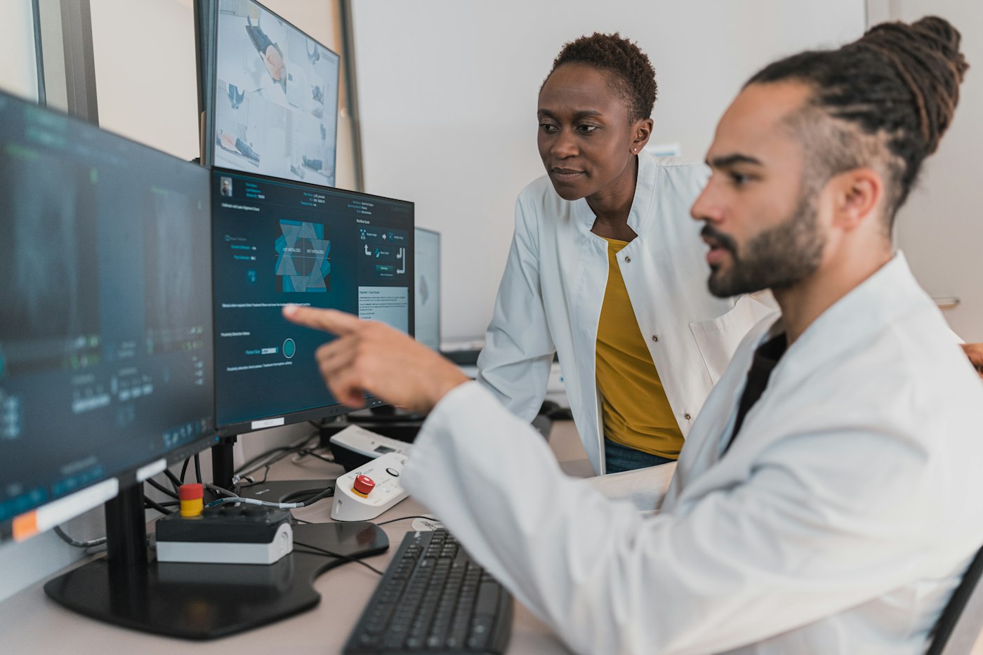 Radiologists reviewing images on monitors