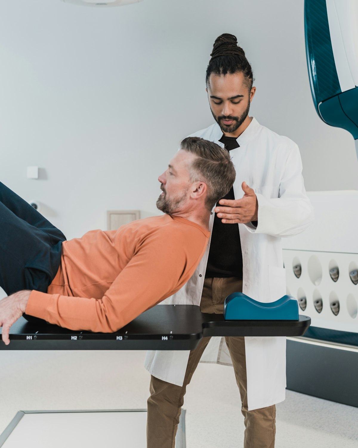 Radiographer positioning a patient for imaging